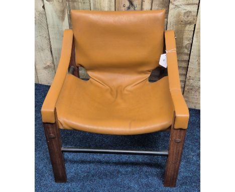 A mid-century MCM Chelsea Safari sling chair design piece, by Maurice Burke for Arkana Furniture, teak and cognac faux leathe