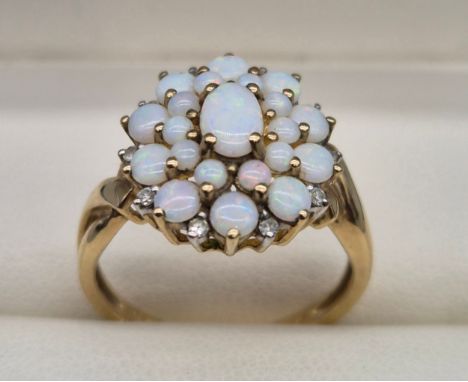 9ct yellow gold opal cluster and diamond stone ring. Opal cluster form and having 10 small round cut diamonds to the edge of 