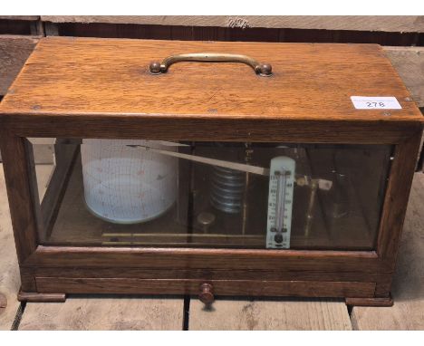 Early 20th century barograph fitted within an oak and bevel glass casing. Having a brass carry handle. 20x35x15.5cm. 