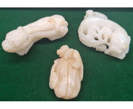 A Collection of three Chinese hand carved sculpture's; Two Carved foo dogs laying down &amp; Monkey Perched on a tree trunk s