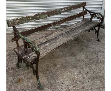 Large Victorian garden bench. Having Cast iron ornate sides. May need to replace wooden slats. 
