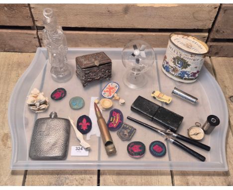 Tray of collectables; Radiometer (Light mill), Bone carved mermaid siren sculpture. Bullet bottle opener, Scout patches, Egyp