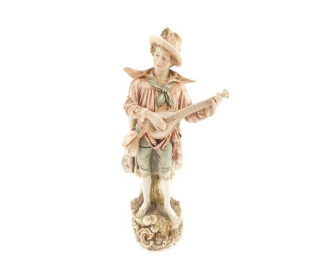 A Royal Dux porcelain figure of a lute player, No 141, modelled standing in rustic costume, on a naturalistic circular base, 