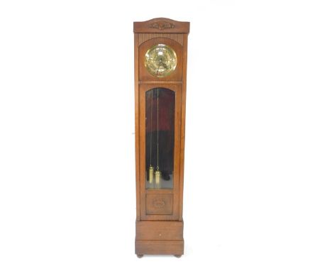 An early 20thC oak cased long case clock, circular brass Art Nouveau dial with Arabic numerals, two train movement, with West