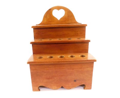 A Welsh pine cawl spoon rack, of three stepped form, raised on bracket feet, 39.5cm H, 28.5cm W.