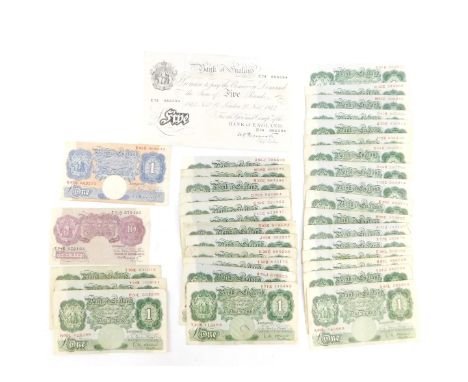 A Bank of England £5 note, Chief Cashier Peppiatt, November 27 1944, serial number E74 086594, Peppiatt £1 note and ten shill