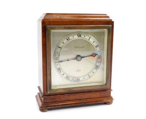 An Elliott mid 20thC mahogany cased mantel clock, retailed by S T Hopper Ltd, rectangular silvered dial with chapter ring bea