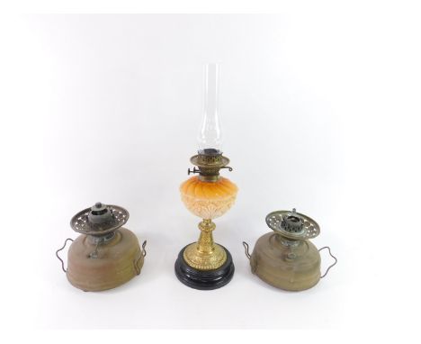 A Victorian brass and opaline glass oil lamp, the orange and pink reservoir decorated with flowers and leaves, raised on a bl