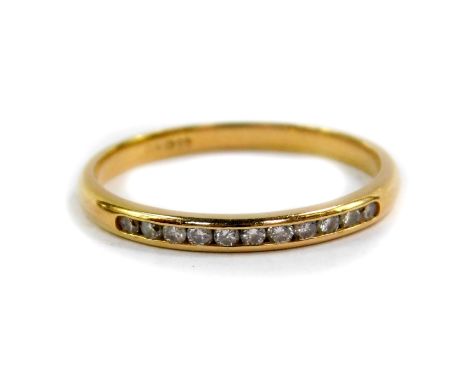 An 18ct gold and diamond half eternity ring, channel set, size O, 1.8g.