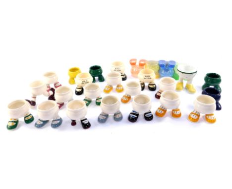 Fifteen Carltonware lustre pottery 'Walking' egg cups, including a peg leg cup, and others.