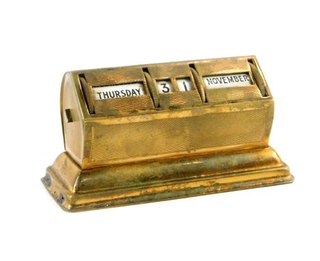 A mid 20thC brass cased perpetual calendar, with engine turned decoration, 10.5cm W.