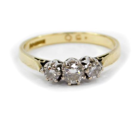 An 18ct gold and diamond three stone ring, approx 0.5cts, size P, 2.8g.