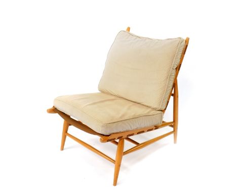 A 1950's Ercol Easy chair, designed by Lucian Ercolani, beech framed with a fitted cushion back and loose cushion seat.