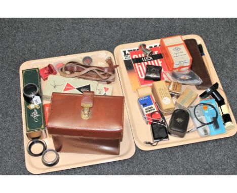 A good collection of photographic related parts, accessories and collectables including - Leica booklets, Nikon eye piece mag