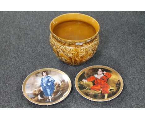 A glazed pottery planter together with two Newcastle wall plates 