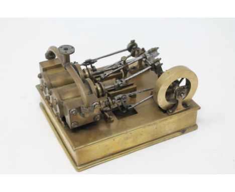 A scratch built brass live steam model together with a boxed miniature brass level and eye glass CONDITION REPORT: The base o