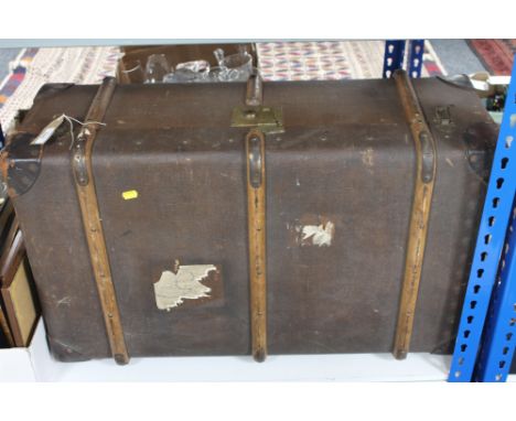 An early twentieth century wooden bound travelling trunk