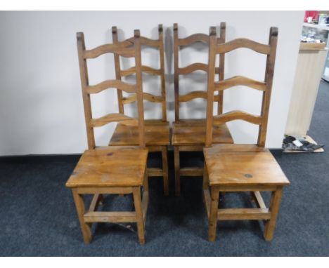 A set of four pine farmhouse ladder backed chairs 