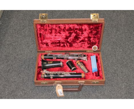 A five piece Boosey and Hawke clarinet in fitted case