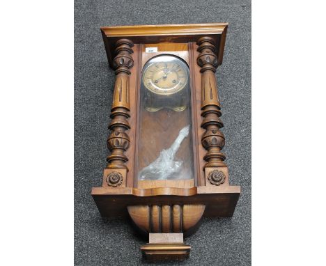 A mahogany cased eight day wall clock with enamelled dial