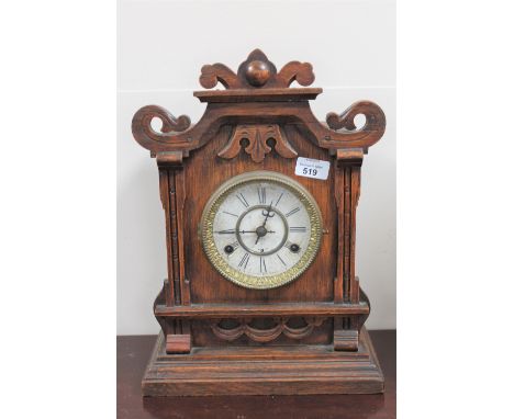 An oak cased eight day half hour strike mantle clock 