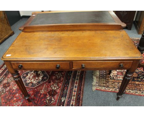 An early Victorian mahogany writing table on reeded legs, width 120 cm CONDITION REPORT: Watermarks and light scratches to to