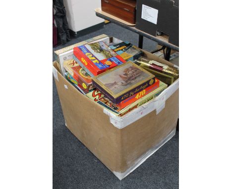 A box of vintage and later jigsaws 