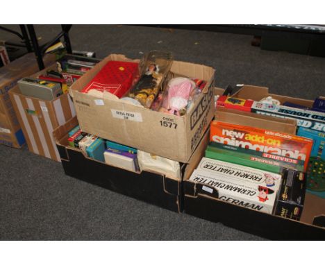 Four boxes of vintage board games, fuzzy felt, dolls of the world etc 