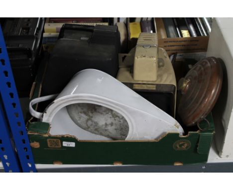 A box containing enamel slipper pan, antique copper hot water bottle, table projector and a cased Bell & Howell Lumina 2 proj