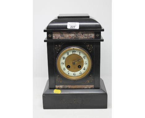 A Victorian slate and marble mantle clock with pendulum and key