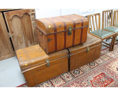 Three vintage tin trunks 