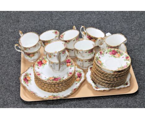 A tray of forty-one piece Royal Albert Old Country Roses tea service together with a boxed Royal Albert place mat