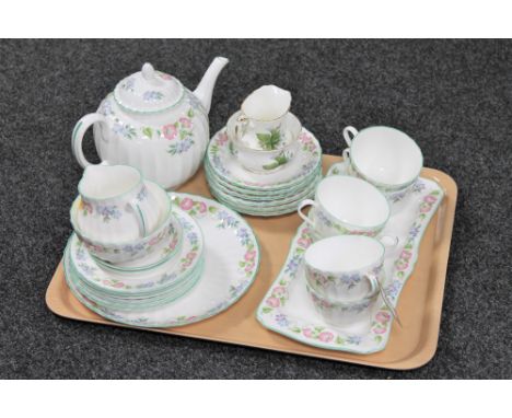 A tray of twenty five pieces of Royal Worcester English garden tea china together with Royal Albert trillium milk jug and sug
