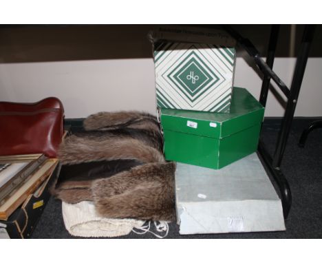 A vintage fur coat together with a boxed wedding dress and two hat boxes containing bags and hats 