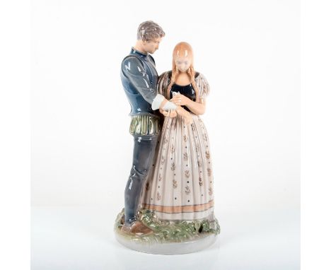 Tall hand painted porcelain figure depicting a maid binding the knights arm. Royal Copenhagen backstamp. Artist: Holger Chris