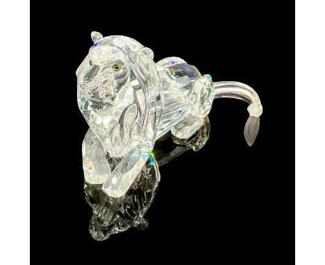 Faceted crystal figurine modeled as a handsome reclining male lion. Colorless crystal with frosted tail tip.Annual edition fr