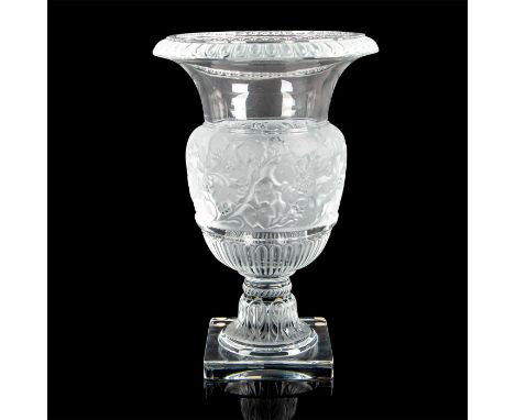 Remarkable clear and frosted crystal urn shaped vessel, decorated with floral and grape vine motif at waist, sitting on a squ