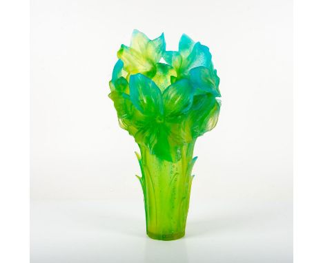 Limited edition, trumpet shaped vessel with blooming amaryllis flowers and upswept leaves in a unique blue and green patte de