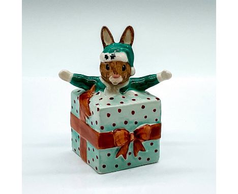 Christmas Surprise DB146; model of a bunny in a green Santa suit popping out of a red spotted green present with a brown bow.