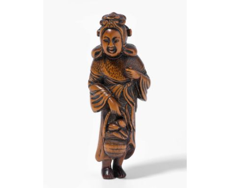 Holz-Netsuke von MitsunobuJapan, 19.Jh. Signiert Mitsunobu. Stehende Benten mit einem Korb voller Früchte in der rechten Hand