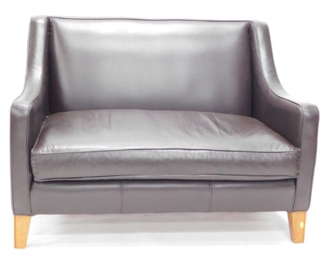 A Multi York black leather two seater sofa. 