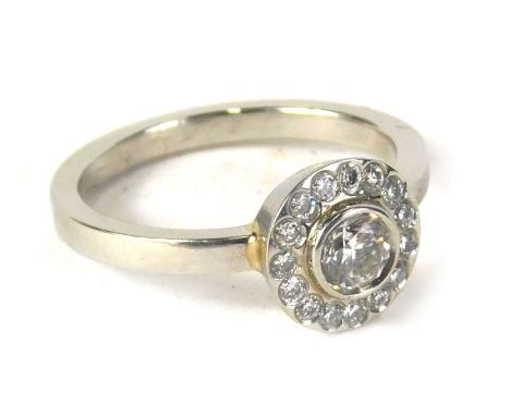 A David Fowkes of Lincoln platinum diamond dress ring, with round brilliant cut centre stone approx 0.42cts in rub over setti