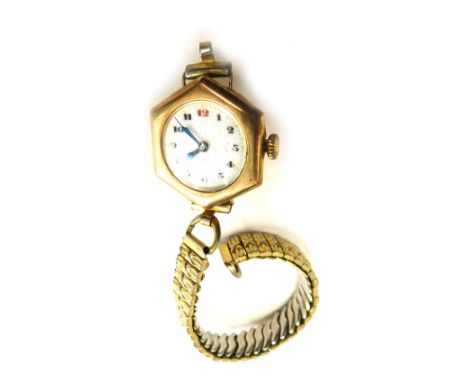 A 9ct gold cased wristwatch, with hexagonal clock face and seventeen jewel movement, with white enamel numeric dial, on a pla