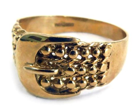 A 9ct gold buckle ring, the central buckle on three strand ball design, with outer twist border, ring size U½, 5.1g. 