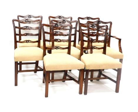 A set of eight Chippendale style mahogany dining chairs, each with a moulded back, including two carvers, with cream upholste