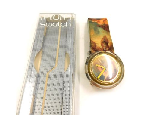 A Swatch Hop Puti watch, designed by Vivienne Westwood with a cherub design, clear Perspex central dial on velvet strap, boxe