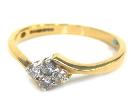 A 9ct gold cross over dress ring, set with an arrangement of small white stones in an illusion setting, size P, 2.1g all in. 