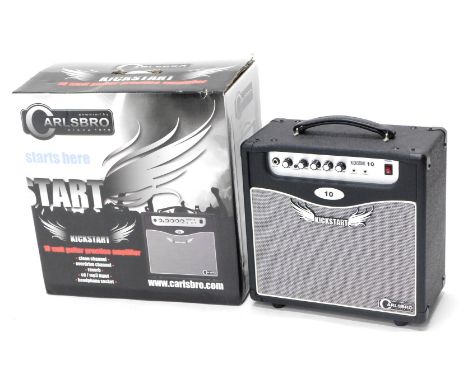 A Carlsbro kick start 10 watt guitar practice amplifier, in original box. 