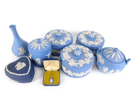 A collection of Wedgwood blue Jasperware, comprising two collectors jars and covers, miniature urn and cover, miniature biscu