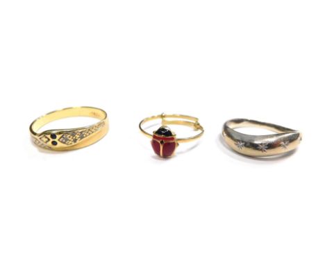 Three dress rings, comprising an 18ct gold snake diamond and sapphire dress ring, ring size N, a costume jewellery ladybird e